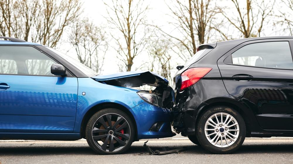 Two cars in a fender-bender crash, leaving the drivers to wonder what to do after a car accident in Illinois