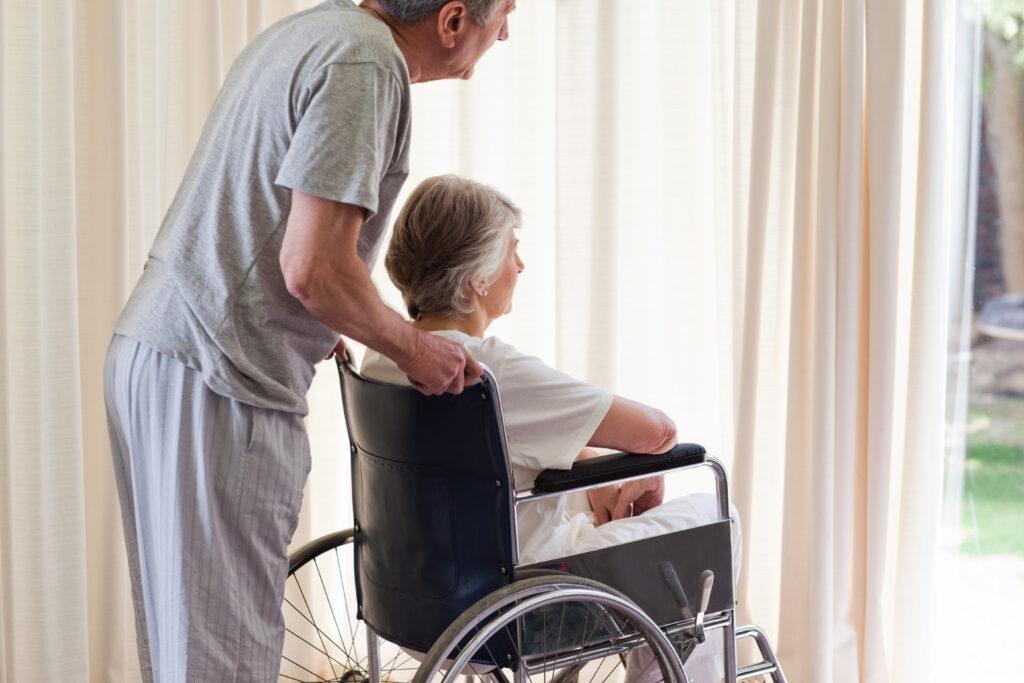 A care worker shouting at an elderly nursing home resident, an example of nursing home abuse.